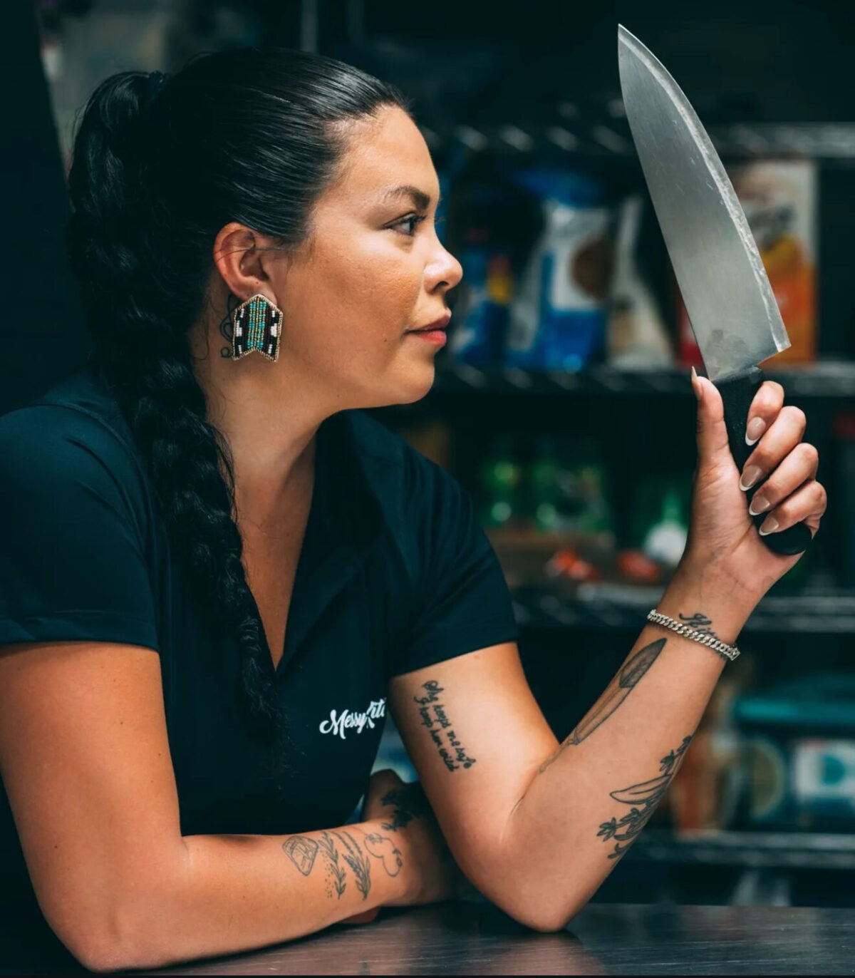 Anna Lazare posing with a Chef knife
