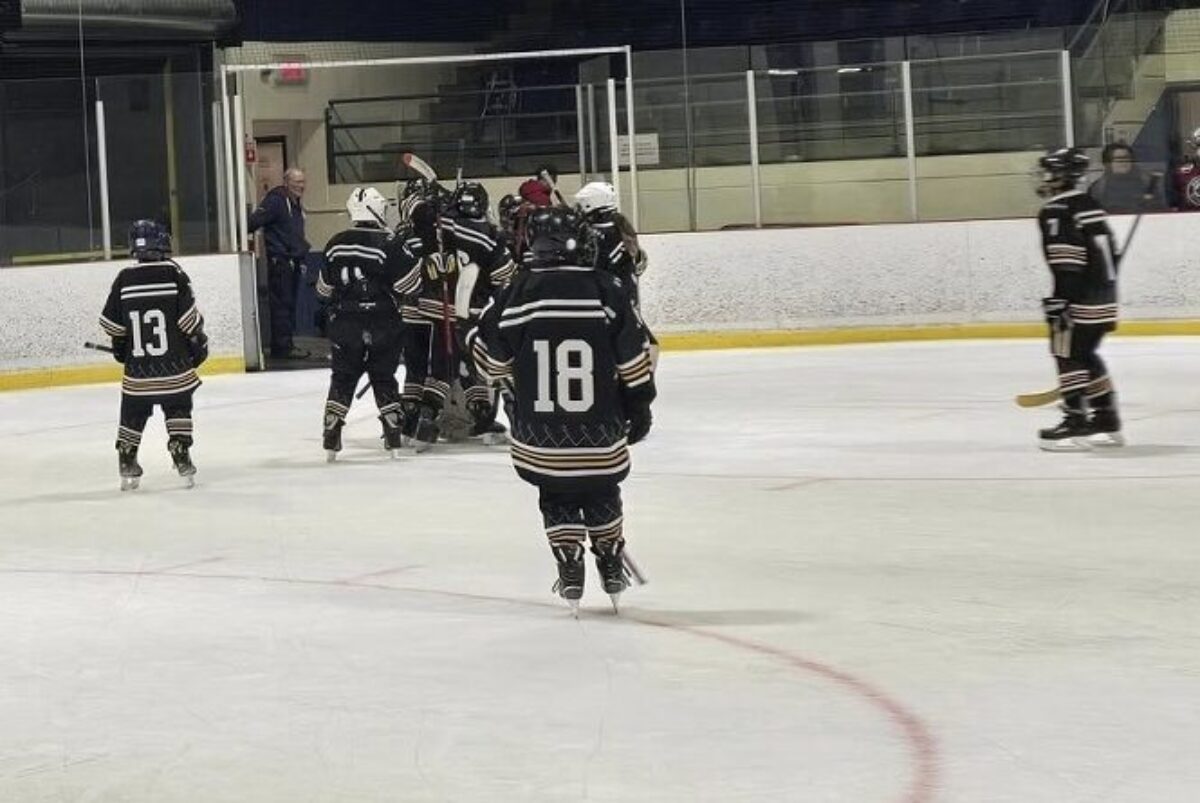 Players skating off the ice after the end of the game