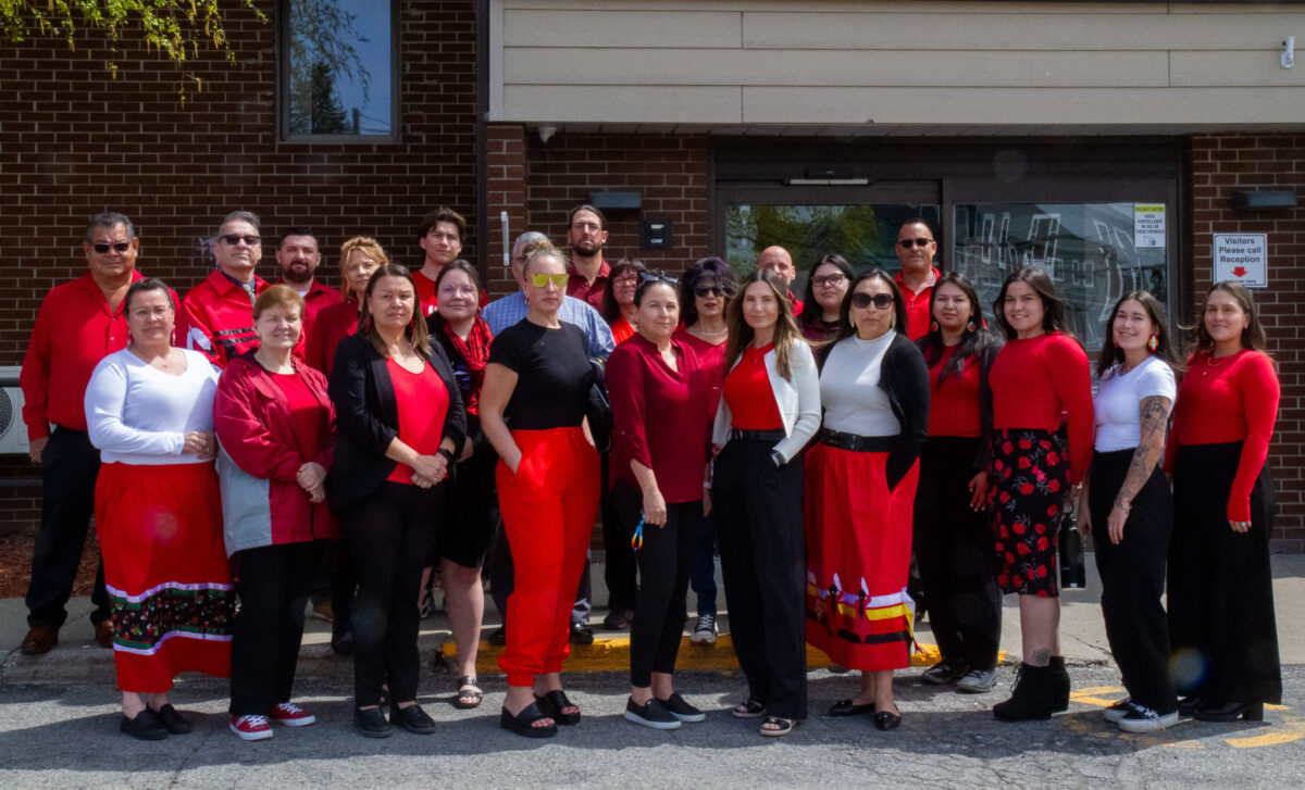 Council chiefs and employees of the Mohawk Council of Kahnawake posed for a picture wearing red clothing or accessories on Monday to mark Red Dress.