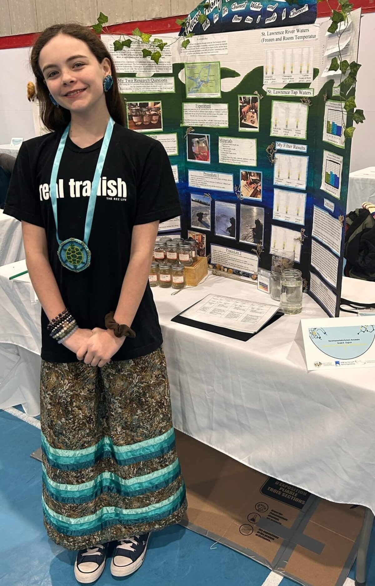 Kahnawiiostha Whyte-Turner in front of her project.