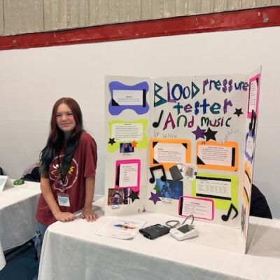 Willow Jackson in front of her project