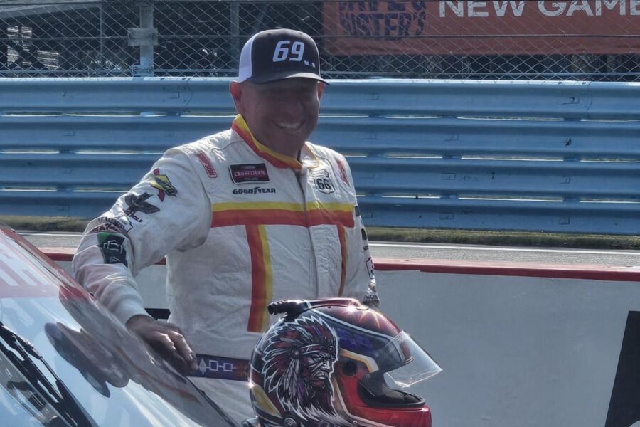 Derek White posing with his car before the race.