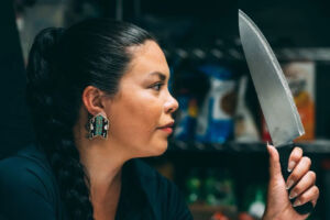 Anna Lazare posing with a Chef knife