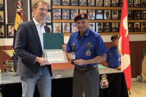 Peter “Pitt” Jacobs, right, alongside member of Parliament Marc Miller. Jacobs was among six veterans in Kahnawake given the King Charles III’s Coronation Medal at a ceremony on Wednesday.