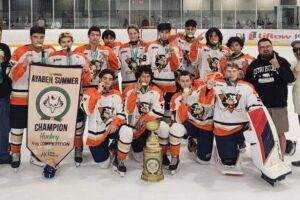 The U15 CreeHawks taking the pose and celabrating their win.