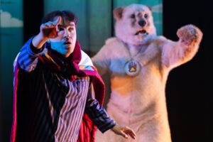 Dylan Thomas-Bouchier playing Jordan with Todd Housemanis playing Maskwa, a giant teddy bear