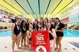 Capital Wave Water Polo club taking the pose with their trophy.