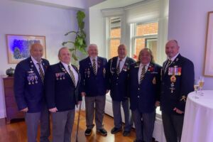 Kahnawake veterans from the Royal Canadian Legion Mohawk Branch 219 (from left to right) Peter “Pitt” Jacobs, Louie Stacey, Gerald Marquis, Legion president Ray Deer, Eric Bush, and Tracy Cross posing for a group photo.