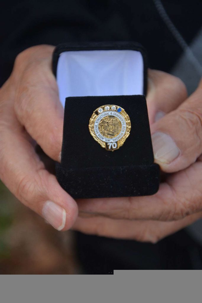 The Local 361 union presented Johnny Hemlock and other old timers with a dedication pin earlier this month. (Jessica Deer, The Eastern Door)