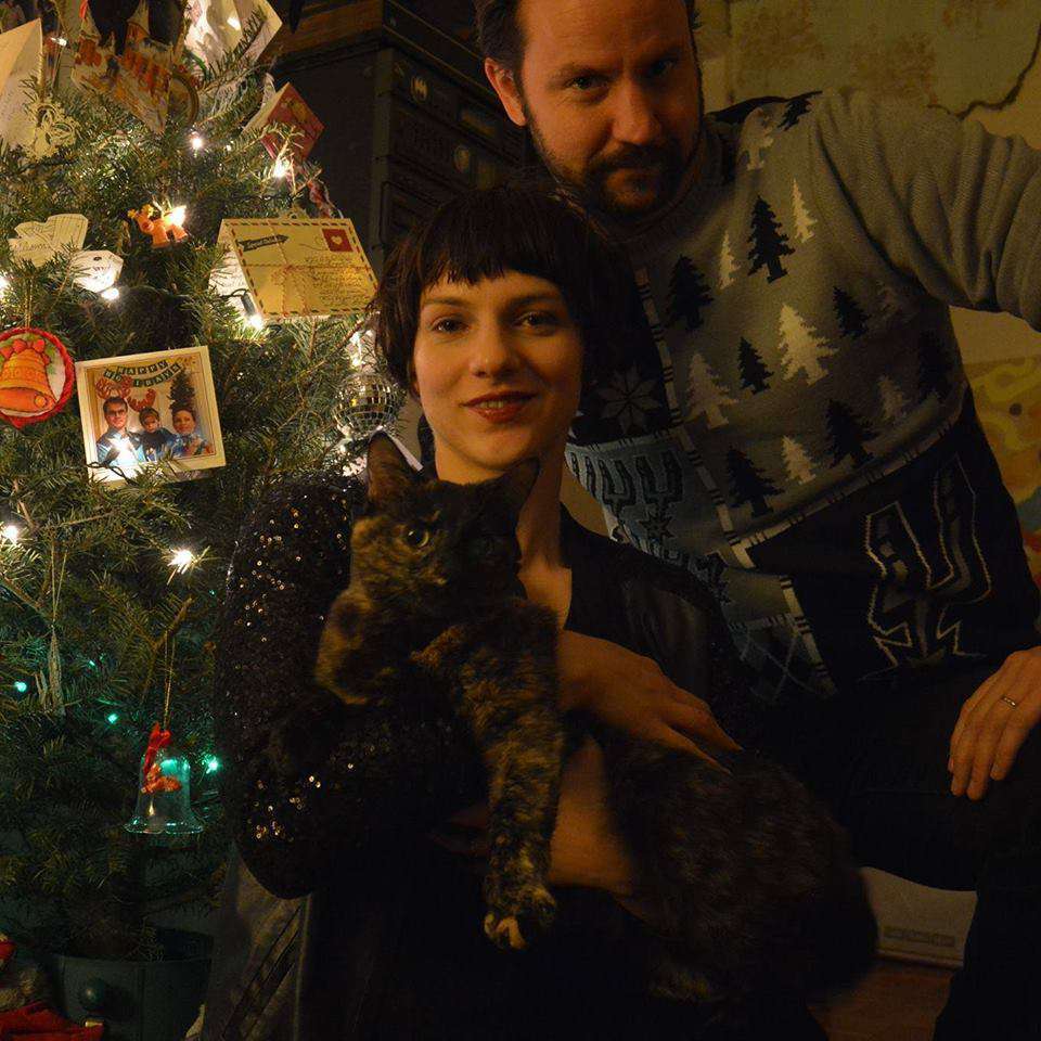 Part of truly appreciating your cat's value is ensuring there is no family portrait done without her presence. (courtesy Daniel J. Rowe)